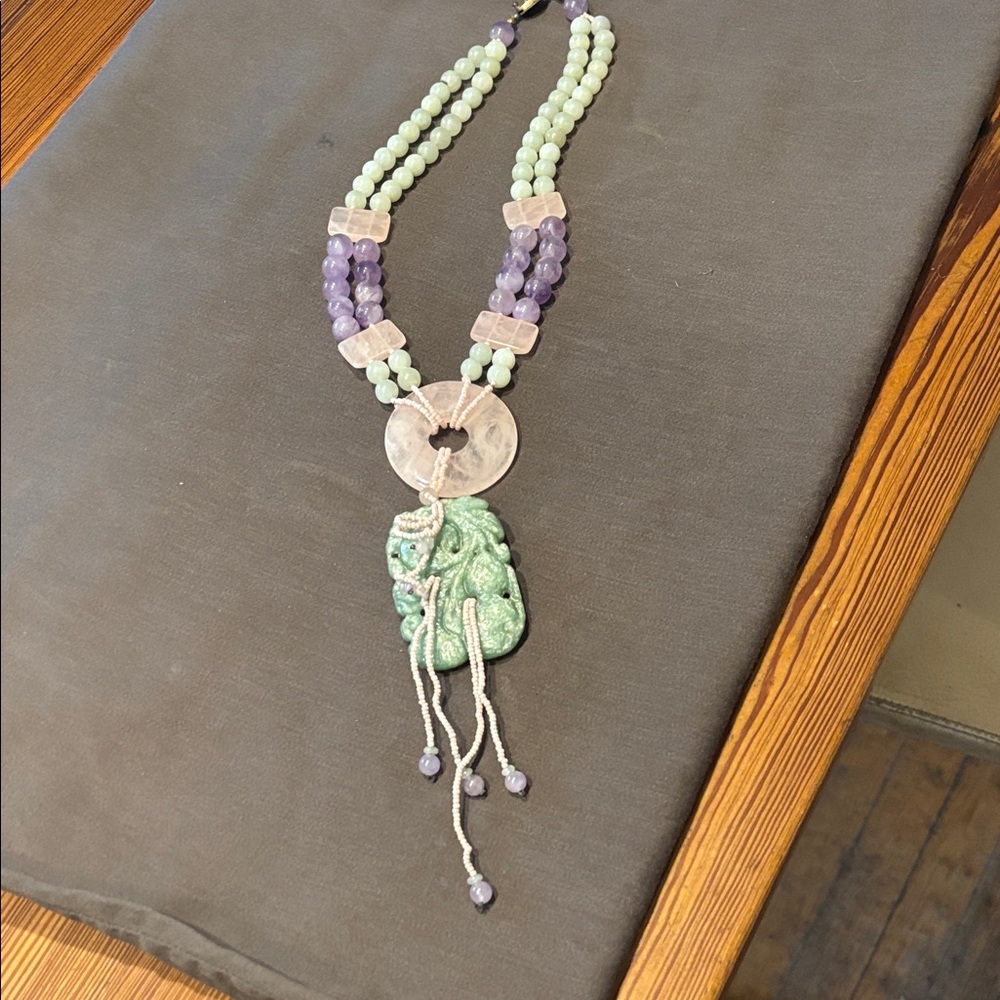 Stone bead and carved stone necklace.